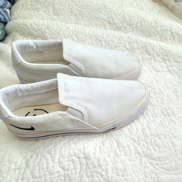 Nike Shoes - Womens size 9 white Nike slip ons.  Gently used worn only few times.